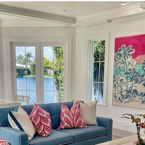 Beach Life Living on Instagram: "Coastal family room with pops of color. Coral pinks, palms and sky blues are the colors designer Lynn Morgan choice for this family room. Keeping it casural for a place to relax. ⁠ ⁠ Designer:@lynnmorgandesign ⁠ Art by @coreymason, @brintzgallery⁠ ⁠ #homedecor #homeinsps #familyroom #waterview #coastalhome⁠ #beachhouse #homedecorating #homestyle #interiordecorating⁠ #bluesofa #housebeautiful #coffeetable #pillows ⁠" Coral Coastal Living Room, Pink And Blue Coastal Decor, Room With Pops Of Color, Light Blue And Coral Throw Pillows, Coastal Family Rooms, Backgammon Table, Color Coral, Blue Sofa, Hilton Head