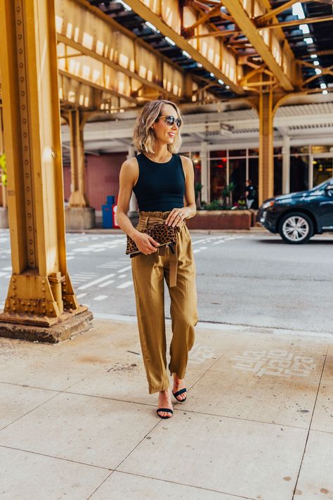 These paper bag pants and black tank make for a cute work outfit or date night outfit. Pair it strappy sandals and a leopard clutch #summerstyle #blacktank #paperbagpants Bag Pants Outfit, Paper Bag Pants Outfit, Spring Challenge, Paper Bag Jeans, Cutest Clothes, Paperbag Hose, Paper Bag Pants, Paper Bag Waist Pants, Bag Pants