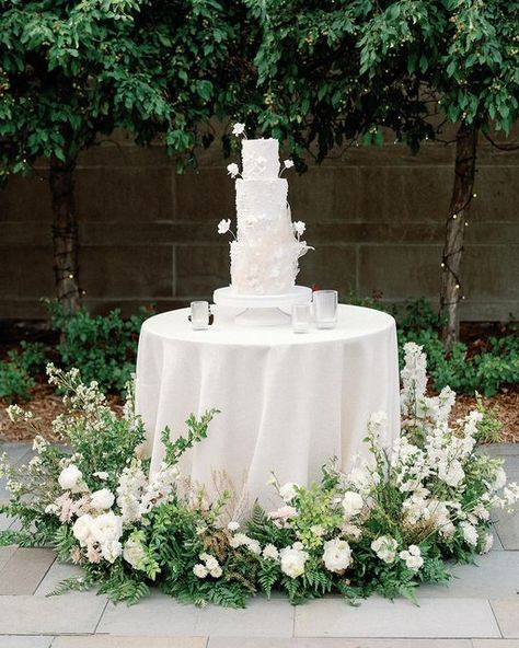 Ashley Fox Designs on Instagram: "A+S cake moment captured by @maritwilliamsphoto . Diaphanous layers of sugar and delicate flowers crafted by @ink_sweets surrounded by pure white lisianthus, sandstone roses, delphinium and pennycress . Images @maritwilliamsphoto Venue @amswedinstitute Management @naomi_anderson_events Floral Design @ashleyfoxdesigns Catering @amswedinstitute_events Desserts @ink_sweets Rentals @apreseventandtent DJ @instantrequestdj"