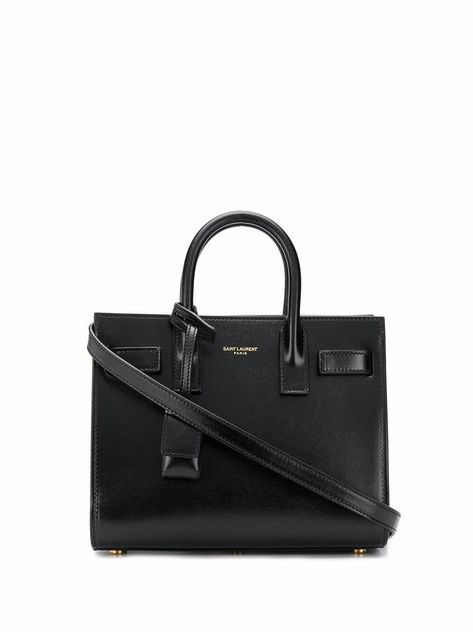 Luxury Designer Saint Laurent at Up to 70% Off Retail. Real or Your Money Back. Shop The Luxury Resale Marketplace Made by Women, for Women. Your Fave Brands Coming in Hot Daily. HANDBAG SAINT LAURENT, LEATHER 100%, color BLACK, Measurements 22x16x10cm, Handle 8cm, Shoulder Strap 56cm, Model Name SAC DE JOUR NANO, CO, product code 39203502G9W1000  |  Tradesy is the leading used luxury fashion resale marketplace | 100% AUTHENTIC, OR YOUR MONEY BACK | We have a zero-tolerance policy for replicas. Saint Laurent Bag Tote, Sac Yves Saint Laurent, Yves Saint Laurent Bag, Dark Luxury, Dream Bags, Black Leather Top, Designer Totes, Classy Style, Chic Bags