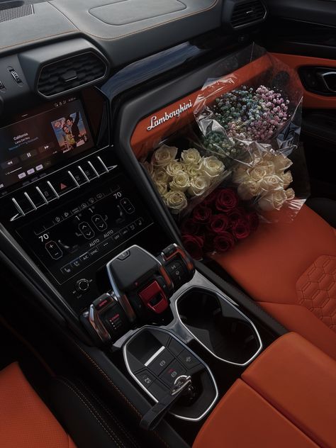 Luxury Interior Car, Old Money Flowers, Urus Aesthetic, Orange Car Interior Aesthetic, Lamborghini Urus Aesthetic, Orange Urus, Cars And Flowers, Orange Car Interior, White Lamborghini Urus