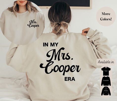 In My Engaged Era Sweatshirt, Fiance Shirt, Custom Bride, Engagement Gift for Her, Engaged AF, Bridal Shower Gift, Bachelorette Shirt, Bride For more Custom Vintage Style Tees View our Shop: https://www.etsy.com/shop/NuvaRose Sizes ♡ Our recommendations for T-Shirts ♡ ♡ For a standard fit, stick with your typical size ♡ For an oversized fit, size up ♡ For a fitted shirt, size down. ♡ Shirts are longer. Great for knots, Tucks, or nice coverage with leggings. ♡ Unisex Cut. Ladies Small: 2-4 ♡ Medi Future Mrs Sweatshirt, Hubby Sweatshirt, Mrs Hoodie, Valentines Cricut, Mrs Shirts, Future Mrs Shirt, Hubby Wifey Shirts, Bride Hoodie, Wife Shirts