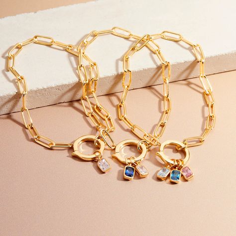 This bracelet is the perfect gift for a girl who loves a bit of sparkle. The Colette Birthstone Bracelet features a dainty paperclip chain and a shimmering birthstone charm that will shine for years to come. Available in 14k gold plated or rhodium plated brass and birthstone charm 14k gold plated sterling silver or rhodium plated sterling silver Mackenzie Birthstone Charm: 1/8"x1/4" cubic zirconia charm Colette Charm Bracelet: 7 inch elongated link paperclip chain hinge closure Protected with an Birthstone Bracelet For Mom, Birthstone Bracelet, Staple Necklace, Modern Jewellery Design, Birthday Bracelet, Gold Charm Necklace, Trendy Necklaces, Birthstone Bracelets, Unique Bracelets