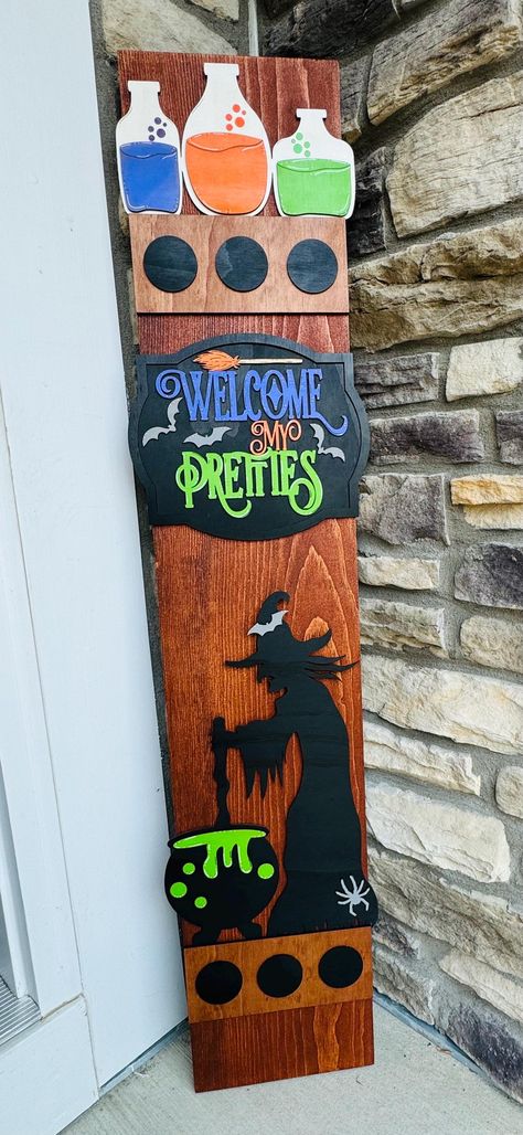 Introducing the new Halloween porch leaner post. These versatile decorations are perfect for displaying by your front door, enhancing seasonal front porch decor, hanging in a mudroom, or brightening up an entryway. Designed for outdoor use, they can also be used indoors, in a camper, or given as a thoughtful gift. Each post comes with a wire hanger on the back to secure it in place, especially if you choose not to hang it, preventing it from being blown over by the wind. The beautifully crafted Front Porch Witch Decorations, Hocus Pocus Porch Leaner, Halloween Door Leaner, Halloween Porch Boards, Halloween Welcome Signs Front Porches, Witches Faces, Address Sign Ideas, Halloween Wooden Signs, Wood Painting Ideas