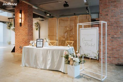 A simple all white entrance with the registration table, welcome board on flower rack decorated with pastel themed roses in a box vase. Wedding Registration Table, Registration Table, Flower Rack, Welcome Board, Welcome Boards, Sign Stand, Brick House, White Decor, Event Styling