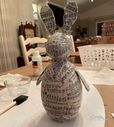 Easter Hymnal Music Rabbit Decor - WM DESIGN HOUSE Easter Floral Centerpieces, Easter Hare, Paper Mache Eggs, Paper Mache Clay, How To Tie Ribbon, Diy Table Decor, Spring Craft, Paper Mache Sculpture, Tanah Liat