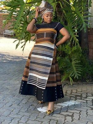 24 Xhosa Traditional Attire for Women 2024 - Best in South Africa Modern Xhosa Attire, Shweshwe Dresses For Makoti, Xhosa Traditional Attire, Xhosa Attire, Shweshwe Dresses, Fashion Stand, Cultural Identity, Traditional Attire, Modern Outfits