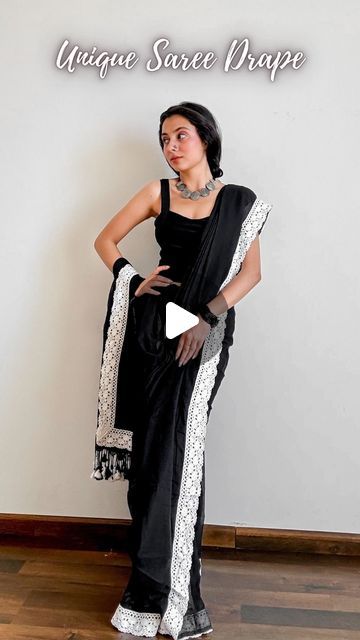 𝐀𝐫𝐜𝐡𝐞𝐞 | Saree Drapes on Instagram: "Save and send this unique saree draping tutorial to a saree lover 🖤  Saree of the day- draped a stunning pure mul cotton in deep black contoured with white lace and cute tassels.  Paired it with a black cropped top, braided my hair and added junk jewellery. (choker, and nosepin)  Cottons are so pretty but can’t always style them plain so I decided to do a chic drape and now I can’t unsee this wholesome beauty.  How to wear a saree as a beginner- 🖤 Pick lightweight pure silk sarees fabric like katan silk, tussar silk, mysore silk, mulberry silk, khaddi chiffon, Khaddi Georgette, gajji silk, assam silk and pure cotton. 🖤 Choose a contrasting design blouse. Refer to pinterest for blouse design ideas. 🖤 Start by wearing your heels or any footwear Georgette Saree Draping Styles, Modern Saree Draping Styles, Black Saree Contrast Blouse, Plain Sarees With Contrast Blouse, Unique Saree Draping, Modern Saree Draping, Saree Draping Tutorial, Drape Skirt Pattern, Blouse Design Ideas