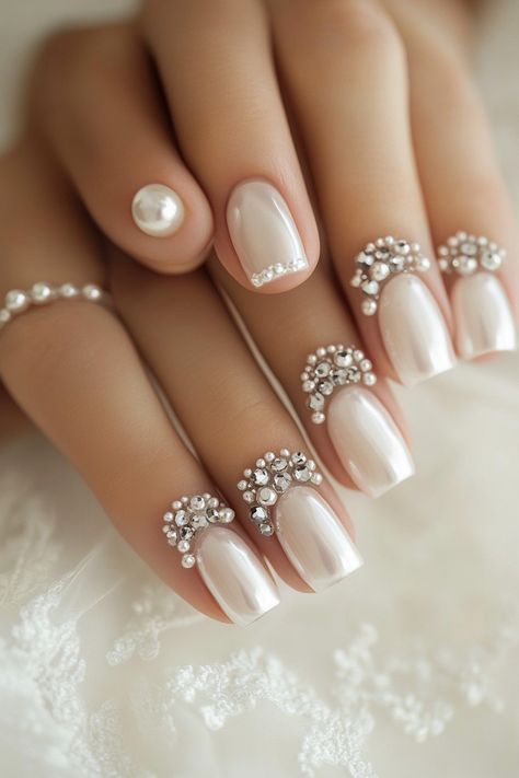 Wedding day manicure. Pearl accent details, crystal-tipped French tips.

First impressions last a lifetime - and that’s why every detail matters on your big day, especially when it comes to your nails. Presenting 39 mix of timeless classics and trendy bridal wedding nail art designs that promise to make your ring exchange even more photogenic. Whether you're all about…

Read more: https://tastywed.com/generated-post-39-creative-bridal-wedding-nail-art-designs-and-tips/ Cathedral Wedding Ceremony, Wedding Nail Art Designs, Watercolor Wedding Cake, Wedding Ceremony Setup, Wedding Nail Art, Cake Design Inspiration, Wedding Nail Art Design, Ring Exchange, Wedding Nail