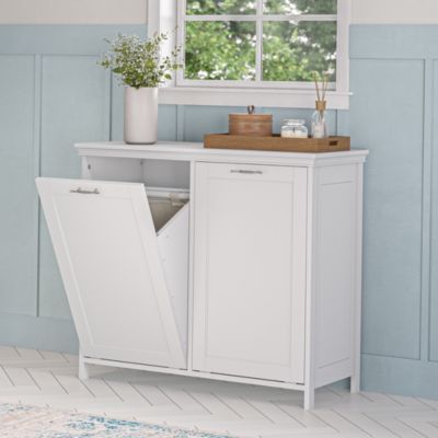 Keep dirty laundry and towels neatly hidden away with this stylish Double Tilt-Out Laundry Hamper Cabinet. Features a classic design and attractive detailing with inset door and side panels, coved top shelf and a two-tone satin/mirror finish handle. The removable, interior cloth hamper storage bags make for an easy transfer to the washer while the tilt-out laundry cabinet doors allow you to easily open and toss clothes, towels and more into the inner hamper bags. Laundry room cabinet anchors to the wall for added stability. Pair with additional Somerset Collection items for clean, classic appeal. Additional Dimensions: Cabinet Interior: 15.25" W x 12.48" D x 25.47" H Laundry Bags: 10.04" W x 12.40" D x 17.32" H | RiverRidge Home Somerset Double Tilt-Out Laundry Room Hamper Storage Cabinet Laundry Room Hamper Storage, Laundry Room Hamper, Laundry Hamper Cabinet, Hamper Cabinet, Tilt Out Laundry Hamper, Laundry Cabinet, Cabinet Interior, Hidden Laundry, Laundry Room Wallpaper