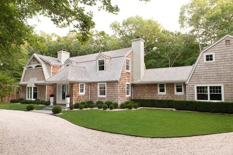 Out of all the different exterior housing materials to choose from, cedar siding is one of the most coveted. But what colors look good next to it? Scroll ahead for 10 of our favorites. Craftsman Style Garage Doors, Garage Door Ideas, Red Brick Exteriors, Stucco House, Exterior Gray Paint, Cape Style Homes, Blue Siding, Cedar Shake, Craftsman Cottage