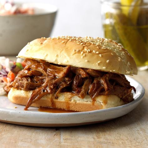 Honey and ground ginger are the flavor boosters behind my no-stress sandwiches. A bottle of barbecue sauce ties it all together in a pinch. —Denise Davis, Porter, Maine Honey Pulled Pork, Slow Cooker Pulled Pork Sandwiches, Mustard Pork Tenderloin, On A Bun, Pepperocini Recipes, Slow Cooker Pulled Pork, Pot Luck, Pork Sandwich, Pulled Pork Sandwich