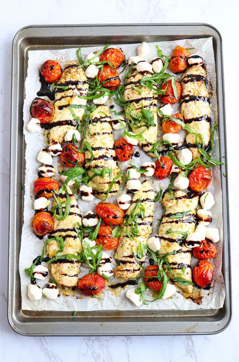 a cookie sheet lined with white paper with chicken tenders, cherry tomatoes, balsamic reduction, mozzarella and fresh basil One Sheet Recipes, Healthy 1 Pan Dinners, Sheet Pan Meals For A Crowd, High Protein Low Carb Sheet Pan Meals, Super Easy Recipes Quick, March Dinner Ideas, Sheet Pan Meal Prep, Sheet Pan Dinners Healthy, Sheet Pan Meals