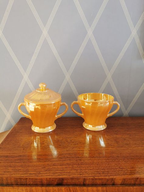 This is a wonderful set of a sugar bowl with lid and a creamer bowl in a Peache Luster glass from Anchor Hocking, Fire King, USA, 1960s or 70s. The pieces have a beautiful swirl pattern. All pieces are stamped Anchor Hocking,Surburbia, Oven-Proof, Made in USA on the bottom. The set it's in a great vintage condition, like new, only some minimal chips on the lid on the inside. Great gift for any vintage lover! Please take a look at all the photographs as they form an important part of item descrip Weight Set, Shell Pattern, Vintage Lover, Swirl Pattern, Fire King, Anchor Hocking, Dinnerware Sets, Sugar Bowl, Made In