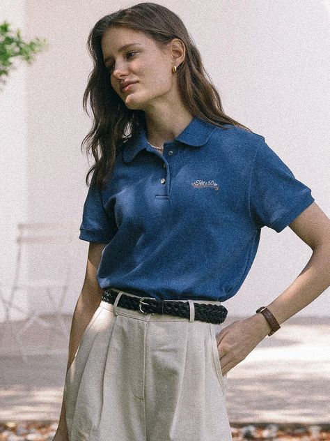 This product offers a modern twist on the classic polo t-shirt, with a terry cloth collar that adds a touch of unique texture. It features an embroidered logo on the chest, which lends an air of casual sophistication. The relaxed fit and breathable fabric ensure comfort without sacrificing style, making it ideal for a range of casual settings. - This Terry Collar T-shirt is crafted with a soft material, providing a comfortable fit for everyday wear.- It comes with a neatly stitched hem and sleeves, contributing to its durability and polished appearance.- The t-shirt's straightforward design is enhanced by a distinctive collar, setting it apart from traditional polos.- The embroidered detail on the chest area acts as a subtle brand signature, offering an elegant finish. Dark Blue Polo Outfit Woman, Polo Collar Shirt Women Outfit, Blue Polo Shirt Outfit Women, Polo Outfit Women's, Polo Shirt Outfit Women's, Smart Casual Polo Shirt, Collar Shirts Women, Dress Smart, Polo Shirt Outfits