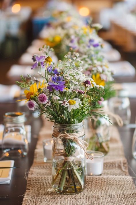 Transform your wedding tables into a storybook scene with our antique book centerpieces! 📚💒 Delicate lace runners and warm votive candles complete the romantic ambiance. Perfect for bibliophiles saying I do! #WeddingInspiration #VintageWedding #BookLover #RomanticDecor #WeddingIdeas #Candlelight #AntiqueChic #LaceDetails Let the love stories of old add charm to your special day! Rustic Farm Wedding Table Decor, Wildflower Wedding Table Setting, Simple Wildflower Centerpieces, Wild Flower Table Decorations, Wildflower Wedding Florals, Wildflower Wedding Table Decor, Rectangle Table Centerpieces Wedding, Sunflower Wedding Table, Boho Wedding Tablescape