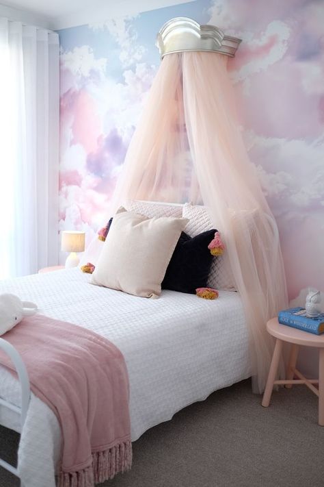 a lovely girl's bedroom with a watercolor accent wall Watercolor Accent Wall, Cloud Wallpaper Bedroom, Story Display, Pastel Kids Room, Olive Bedroom, Girls Rainbow Bedroom, Cloud Bedroom, Girls Bedroom Themes, Indoor Mural