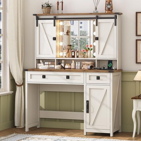 PRICES MAY VARY. [Farmhouse Style] This vanity desk stands out because of its rich farmhouse style. With a perfect blend of distressed white finishes, z-brace barn door trim, and exposed metal hardware, the makeup vanity desk is not only robust and sturdy, but it also has farmhouse charm and adds a relaxed, earthy aesthetic to the room. The unique sliding door design on the upper part can be used to hide the shelves/lighted mirror, both exquisite and practical [Powerful Storage Space] Overall si Makeup Vanity With Lights, Vanity With Lights, Modern Dressing Table Designs, White Vanity Table, White Vanity Desk, Vanity Desk With Mirror, Desk With Mirror, Makeup Vanity Lighting, Farmhouse Vanity