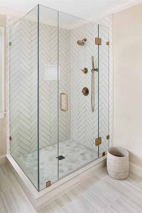 Master bathroom shower with white herringbone tiles and gray grout features perfect dimensional patterns. Herringbone Shower, Patterned Bathroom Tiles, Shower Niche, Bathroom Shower Tile, Bathroom Remodel Designs, Trendy Bathroom, Glass Shower Doors, Bath Room, Shower Remodel