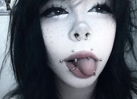 Ear To Mouth Piercing Chain, Black Tongue Piercing, Angel Bite Piercing Fangs, Piercing Set Up, Alt Piercings, Angel Fangs, Aesthetic Piercing, Emo Piercings, Cheek Piercing