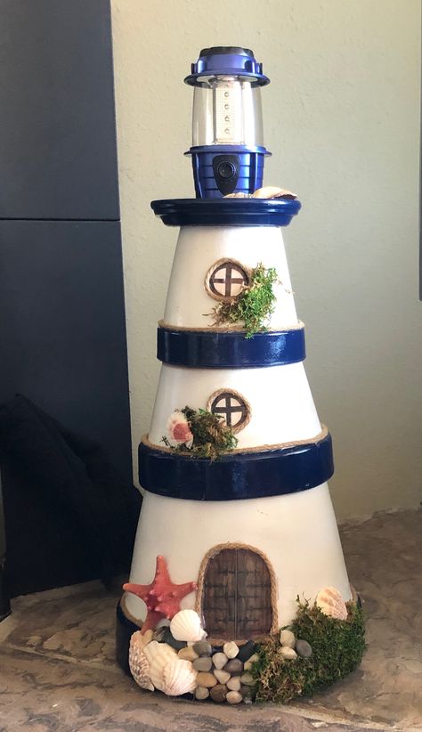 Claypot Lighthouses Diy, Lighthouse Terra Cotta Pots, Terra Cotta Lighthouse, Terra Cotta Pot Lighthouse, Terra Cotta Lighthouse Diy, Lighthouse Planter, Diy Lighthouse Crafts, Diy Lighthouse, Clay Pot Lighthouse