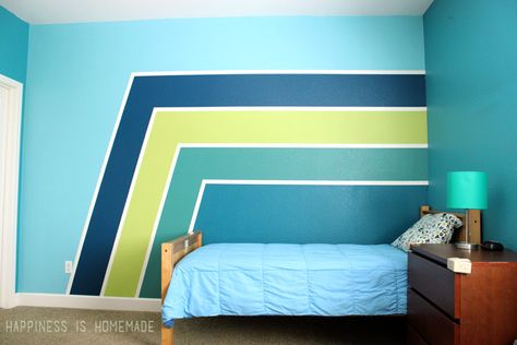 Make a HUGE impact in your bedroom with paint! These racing stripes took only minimal effort, and they completely update the look of the space! Use Frog Tape for perfect crisp and clean lines! Striped Accent Walls, Bedroom Paint Design, Perete Accent, Striped Bedroom, Boys Bedroom Paint, Green Accent Walls, Blue Accent Walls, Accent Wall Paint, Bedroom Wall Designs