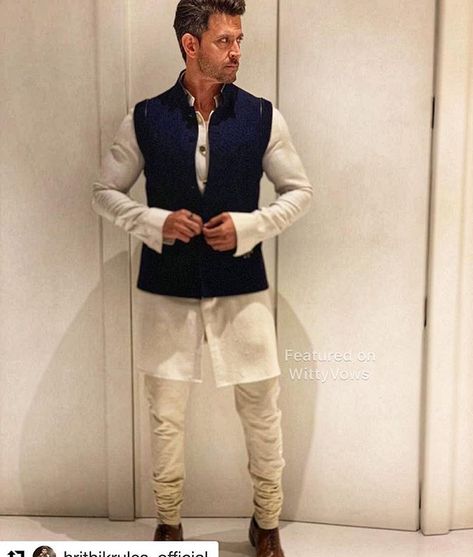 Hrithik Roshan | Bollywood fashion | White Kurta and blue waistcoat | Outfit ideas for Indian Groomsmen | Brother of the groom | Isha Ambani and Anand Piramal Wedding | Antilia | Mukesh Ambani | Nita Ambani | Celebrity Style | Brother of the bride outfit ideas | Featured on WittyVows | Indian Groomsmen, India Fashion Men, Indian Wedding Suits Men, Isha Ambani, Waistcoat Outfit, Blue Waistcoat, Indian Wedding Clothes For Men, Mens Indian Wear, Mukesh Ambani