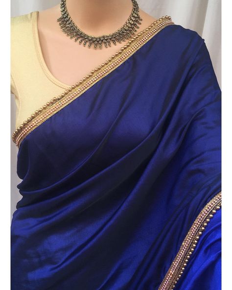 Navy blue malai silk saree with white stone and gold bead lace all over saree. Comes with contrast golden brocade blouse. . 5.5 meters… Plain Blue Saree Contrast Blouse, Navy Blue Saree With White Blouse, Ink Blue Saree Contrast Blouse, Blue Colour Saree With Contrast Blouse, Navy Blue Saree Contrast Blouse, Blue And Gold Saree, Blue Saree Contrast Blouse, Navy Blue Silk Saree, Plain Georgette Saree