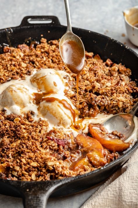 Juicy gluten free peach crisp with a crunchy pecan-oat topping and a drizzle of the easiest homemade dairy free caramel. You're going to LOVE this healthy peach crisp recipe. The perfect summertime dessert with a scoop of your favorite ice cream! #peachcrisp #peaches #healthydessert #glutenfreedessert Gluten Free Peach Recipes, Coconut Milk Caramel, Gluten Free Peach Crisp, Healthy Peach Crisp, Fresh Fruit Desserts, Peach Crisp Recipe, Healthy Summer Desserts, Ambitious Kitchen, Peach Crisp