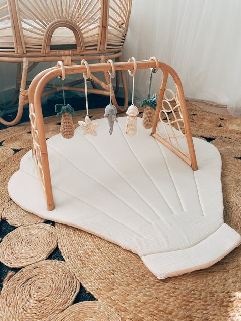 Our handmade rattan playgym is a stylish & sustainable alternative to the plastic variety you see on the market! Baby Boy Beach Nursery, Boy Beach Nursery, Aquarium Nursery, Macrame Toys, Beach Baby Nursery, Beachy Nursery, Lake Nursery, Colorful Nursery, Beach Nursery