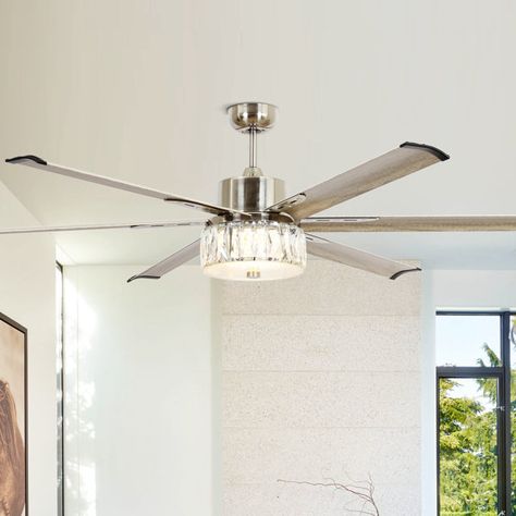 This 65" integrated LED brushed nickel ceiling fan decorated with six wood grain finish aluminum blades is great for large areas or lofts. This ceiling fan features a glam display of crystals to create an elegant, glamorous accent in your room. The 6-speed reversible DC motor housing enables it to not only cool during the summer but helps circulate warm air during the winter. For added ease and elevated luxury, the features and fan functions are adjustable by remote control. Ceiling Fan Bedroom Master Suite, Bedroom Fans With Lights, Bedroom Ceiling Fans With Light, Modern Ceiling Fans Living Room, Glam Ceiling Fan, Ceiling Fan Ideas, Bedroom Ceiling Fans, Elegant Ceiling Fan, Lightning Ideas