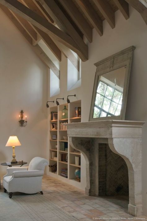 Murphy Mears / Fabulous Limestone Fireplaces Fireplace Country, French Fireplace, Limestone Fireplace, Mirror On The Wall, Home Fireplace, French Country House, Fireplace Design, Fireplace Surrounds, Stone Fireplace