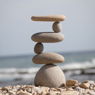 Rosecliff Heights Representing safety, hope, and friendship, cairn stones have been used by cultures around the globe for centuries. Made of real stones and a steel rod, each cairn garden stone used is selected for its unique and appealing aesthetic. Whether serving as a memorial stone or a directional marker, cairn stones add a sense of balance and calm to the hectic pace of daily life. These stones are stacked up high with natural beach pebbles and river rocks. Every single piece is hand-selec Ideas Para Decorar Jardines, Rock Cairn, Pagoda Garden, Garden Rock Art, Rock Sculpture, River Stones, Pebble Stone, Memorial Stones, Garden Accents