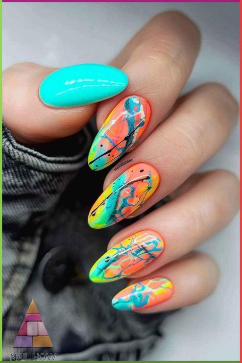 Elevate your nail game with these glowing neon nails featuring an artistic mix of orange, blue, and yellow. These summer nails are ideal for those who love bright nails and unique designs. Explore more at nailhow.com.