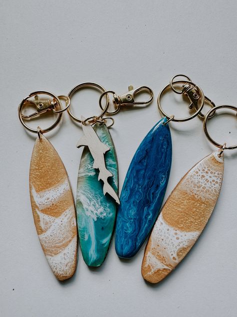 Hand made mini surfboard keychains! perfect for the surfer or beach lover... but watch out for sharks! Never loose your keys in your bag as this surfboard stands out! made with swirling blue resin and lightweight birch wood! it comes with a clasp closure to easily attach to your bag, belt loop, or other keychains! Beach Car Decor, Surfboard Keychain, Mini Surfboard, Keychains Ideas, Surfboard Stand, Beach Keychain, Beach Things, Surfboard Art, Gold Waves