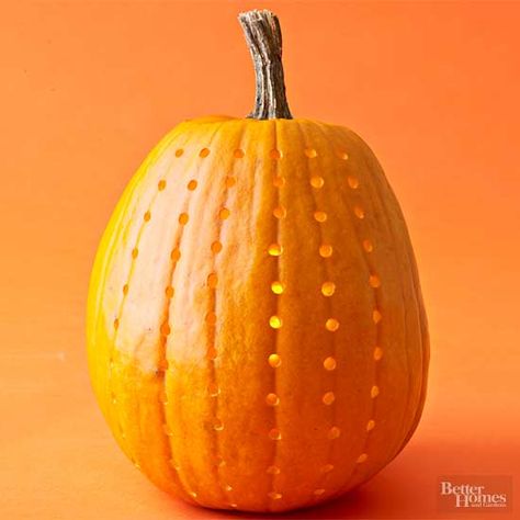 A power drill is another quick and easy way to make perfectly round holes in a pumpkin. Drill holes along the pumpkin veins (or make your own design). Another idea? Put a string of Christmas lights inside the pumpkin and poke the bulbs through the holes. Next: Tools to Use Pumpkin Drilling, Christmas Lights Inside, Children's House, Carve A Pumpkin, Carving Pumpkins, Halloween Pumpkins Carvings, Witchy Woman, Fall Ideas, Fall Decorating