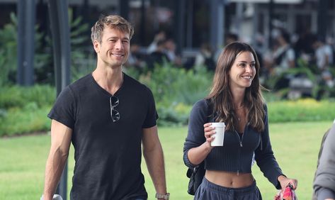 Glen Powell Gigi Paris, Glen Powell And Gigi Paris, Glen Powell Girlfriend, Gigi Paris, Glen Powell, At The Airport, Australia, Paris, Flowers