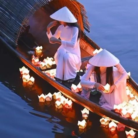 Daniel Kordan on Instagram: "On the tranquil waters of Hue’s Hong River in Vietnam, young women don traditional garb to perform the sacred Candle Flower ritual. This age-old tradition, observed during major holidays and festivals, honors Vietnam’s spiritual values and culture. Each lit flower-shaped lamp represents a prayer for health and peace, creating a captivating spectacle that beautifully embodies the essence of Vietnam’s heritage. Filmed in low light with @nikoneurope Z8 + 50 mm f/1.8 Nik Vietnam Lantern Festival, Flower Ritual, Vietnamese Aesthetic, Vietnam Aesthetic, Hermes Window, Vietnam Culture, Vietnamese Culture, Candle Flower, Prayer For Health