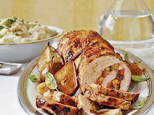 Spicy Fruit-Stuffed Pork Loin & Roasted Pears & Onions Recipe | MyRecipes Spicy Fruit, Dried Fruit Recipe, Holiday Entrees, Roasted Pears, Christmas Main Dishes, Roasted Pear, Stuffed Pork, Pork Loin Recipes, Pork Tenderloin Recipes