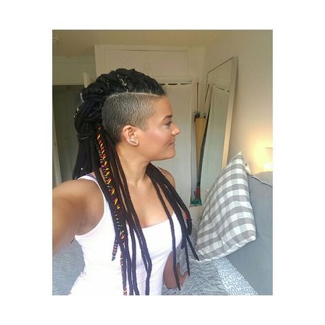 Dreadhawk Hairstyles, Undercut With Dreads, Mohawk Dreads Women, Dreadlocks With Undercut, Long Curly Hair With Undercut, Dread Mohawk, Curly Hair With Undercut, Dreads With Shaved Sides, Dreads Mohawk