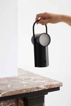 Bijou is a minimalist portable table lamp designed by Brussels-based studio PaulinePlusLuis. Bijou is a portable table lamp. It is inspired by the very first battery-operated lamps. First intented for technical uses – in the areas of mining industry, navy, or railways – they have evolved to become a daily object. Its name comes from one of the first portable lamps that was designed for domestic use, from which its aesthetics is inspired. The Bijou lamp comes from the story and the industrial aes Table Lamps Design, Battery Operated Lamps, Module Design, Lamps Design, Luxury Table Lamps, Portable Table Lamp, Lamps Kitchen, Lighting Techniques, Luxury Table