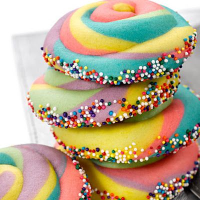 Preheat oven to 350°F. Divide dough evenly into five bowls, and color each with a different color liquid food coloring. Roll each color of dough ... Dr Seuss Treats, Dr. Suess, Dr Seuss Snacks, Rainbow Cookies Recipe, Pinwheel Cookies Recipe, Cupcake Diaries, Dr Seuss Birthday Party, Pinwheel Cookies, Pin Wheel