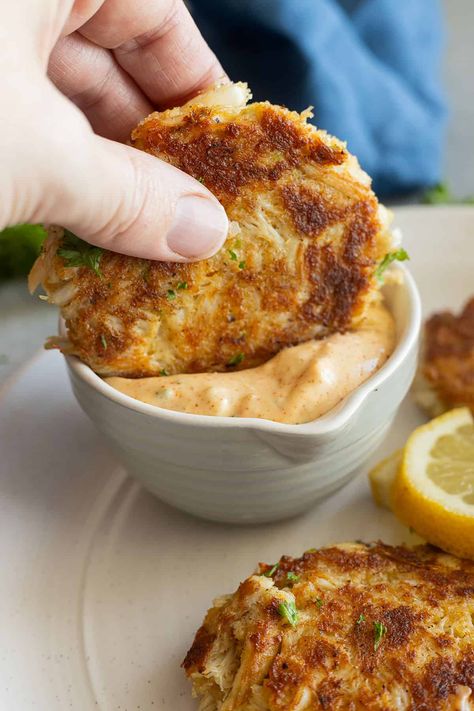 A crab cake being dipped into the remoulade sauce. Crab Cake Remoulade Sauce, Crab Cake Dipping Sauce, Crab Cake Dip, Crab Dipping Sauce, Seafood Fries, Crab Cake Remoulade, Cake Sauce, Crab Cake Sauce, French Sauces