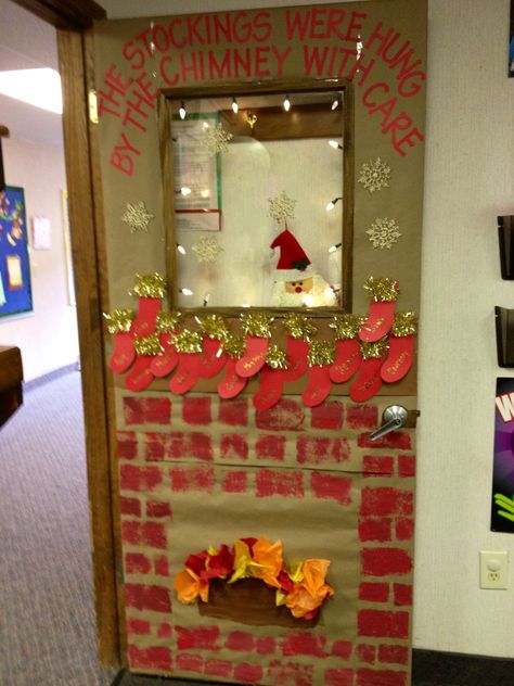 Classroom Door ~ Christmas 2012.  My students sponge painted the brick work, used construction paper and gold garland for stockings, and shaped and glued on tissue paper to create the fire in the fireplace.  Santa is peeking through the window :-)  Door was covered first with craft paper. Winter Classroom Door, Classroom Door Decorating, Xmas Inspiration, Diy Christmas Door, Christmas Classroom Door, Door Decorating Contest, Christmas Door Decoration, Christmas Bulletin, School Doors