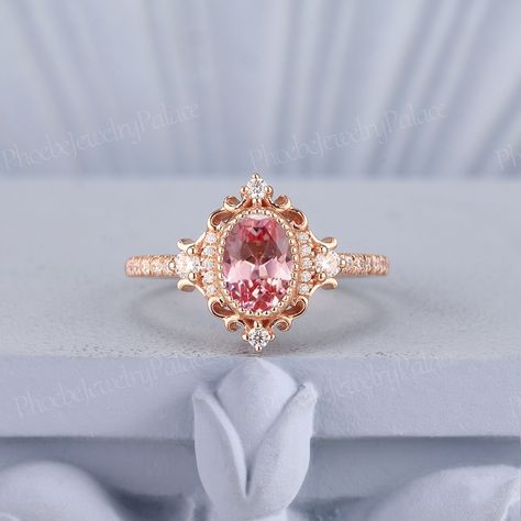 Vintage Peach Pink Sapphire Engagement Ring Oval Wedding Rings for Women Solid Gold Diamond Cluster Cocktail Ring Anniversary Handmade Gift PRODUCT SUMMARY Metal Type: yellow, white or rose solid 10k, 14k or 18k gold. Size: All sizes are available, contact me if they do not contain the size you want in the drop-down menu. ☪☪Engagement ring ⚜Center Stone - Lab Grown Peach Pink Sapphire Cut - Oval Size - 5x7mm ⚜Side Stone - Moissanite or Natural Diamond Cut - Round Weight - 0.21ct Clarity - SI-VS Pink Pearl Engagement Ring, Pink Engagement Ring Vintage, Pink Promise Rings, Oval Wedding Rings, Sapphire Engagement Ring Oval, Peach Sapphire Rings, Pink Sapphire Engagement Ring, Oval Sapphire Engagement Ring, Pink Diamond Engagement Ring