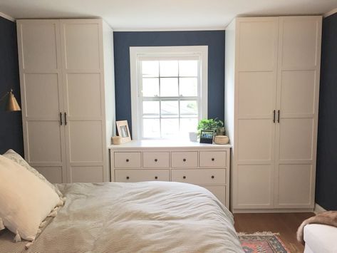 Dark blue and white bedroom, "Gentleman's Gray" by Benjamin Moore. IKEA Pax system with Hemnes door, Hemnes dresser and gray french ticking duvet cover. Closet hardware oil rubbed bronze from Houzz. IKEA storage ottoman. Urban Outfitters floor pillow with tassels on bed. Faux fur throw from Wayfair. Rejuvenation rug. Design by Beam&Bloom. Pax Bedroom, Pax Ikea, Bedroom Built Ins, Pax System, Ikea Bedroom, Blue And, White Bedroom Furniture, Dekorasi Kamar Tidur, Ikea Storage