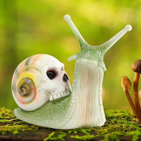 PRICES MAY VARY. Snail Decor: The perfect combination of snail and skull sculpture which is easy to catch the eye, great as home decoration or yard decor, it will definitely add unique style to your home. Durable Material: Made from long-lasting rain and sun resistant poly resin, Printed with outdoor grade paint as the protective coating, no worry about fading even in strong sunlight or under heavy rain. Gardening Gifts: Use novelty backyard decor sculpture to decorate your garden, bring fun to Snail Decor, Fairy Decorations, Yard Office, Posable Skeleton, Poison Garden, Speculative Evolution, Skull Sculpture, Yard Area, Goth Garden