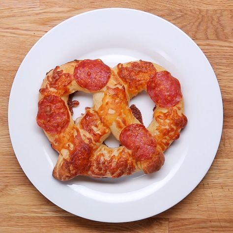 Cheese-stuffed Pizza Pretzels Recipe by Tasty Pizza Pretzel, Stuffed Pretzels, Pretzel Pizza, Pizza Salami, Store Bought Pizza Dough, Stuffed Pizza, Homemade Pretzels, Homemade Soft Pretzels, House Guests