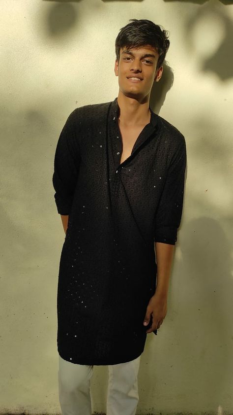 Man leaning against a wall,black kurta,in desi traditional attire, South asian clothes men indian boy Black Kurta Men Aesthetic, Black Kurta For Boys, Men In Kurta Aesthetic, Desi Boy Aesthetic Kurta, Aesthetic Kurtas For Men, Black Kurta Aesthetic, Black Kurta Men, Kurta Aesthetic, Brown Boys