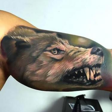 99+ Best Tattoo Ideas for Men Wolf Paw Tattoos, Lobo Tattoo, Tattoo Avant Bras, Tatoo 3d, Bicep Tattoo Men, Small Wolf Tattoo, Wolf Tattoos Men, Inner Bicep Tattoo, Wolf Tattoo Sleeve